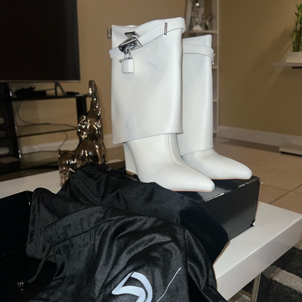 New never worn. Markings due to dust bag. Sold as is. No returns